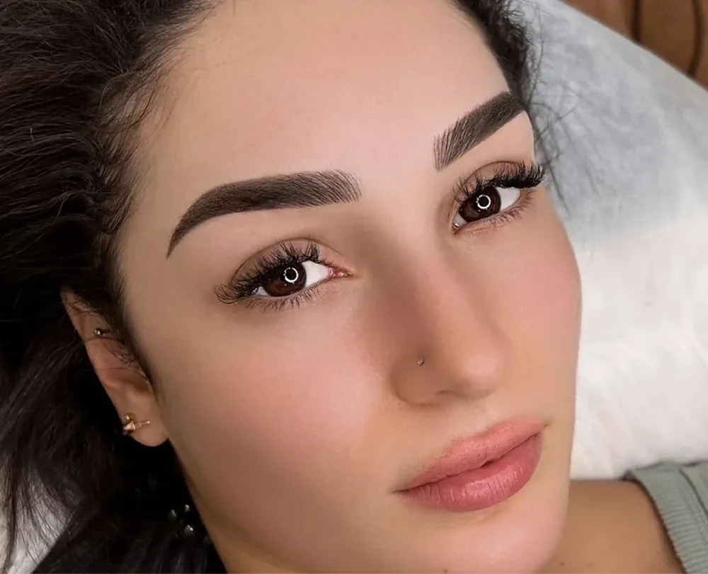 Brow before and after — sparse to crisp defined brows, grey eyes